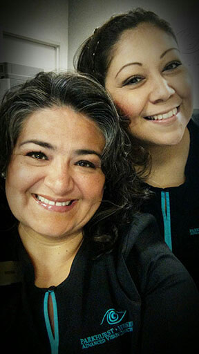 closeup of 2 female employees smiling