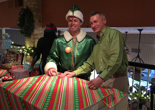 2 employees dressed in green for a Parkhurst Holiday party