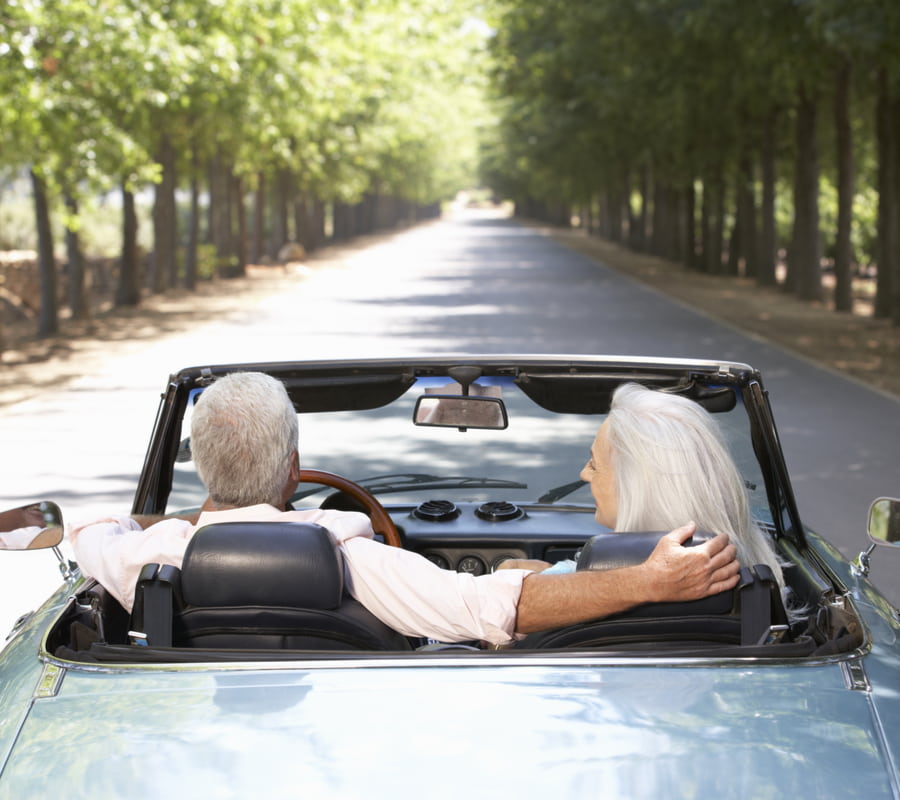 senior couple on a road trip without the need for prescription glasses