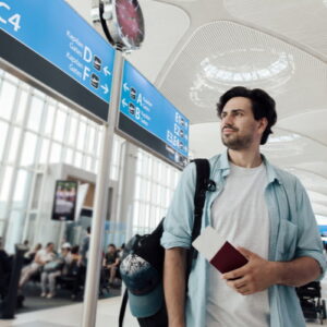 Man walking through an airport to his terminal