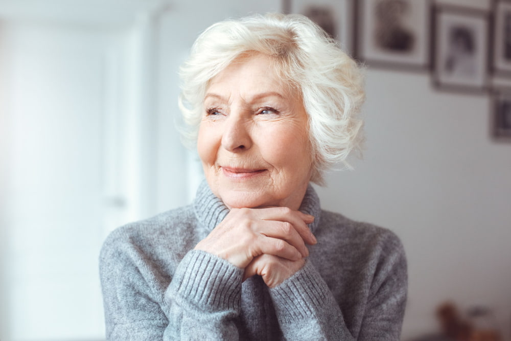 Older grandmother without glasses hanging out in her house