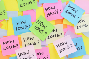 collage of sticky notes that read "how long?"
