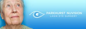 older woman looking up, parkhurst nuvision logo to the right of her face