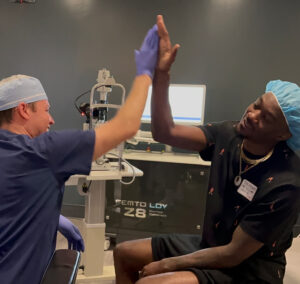 two men high fiving after procedure